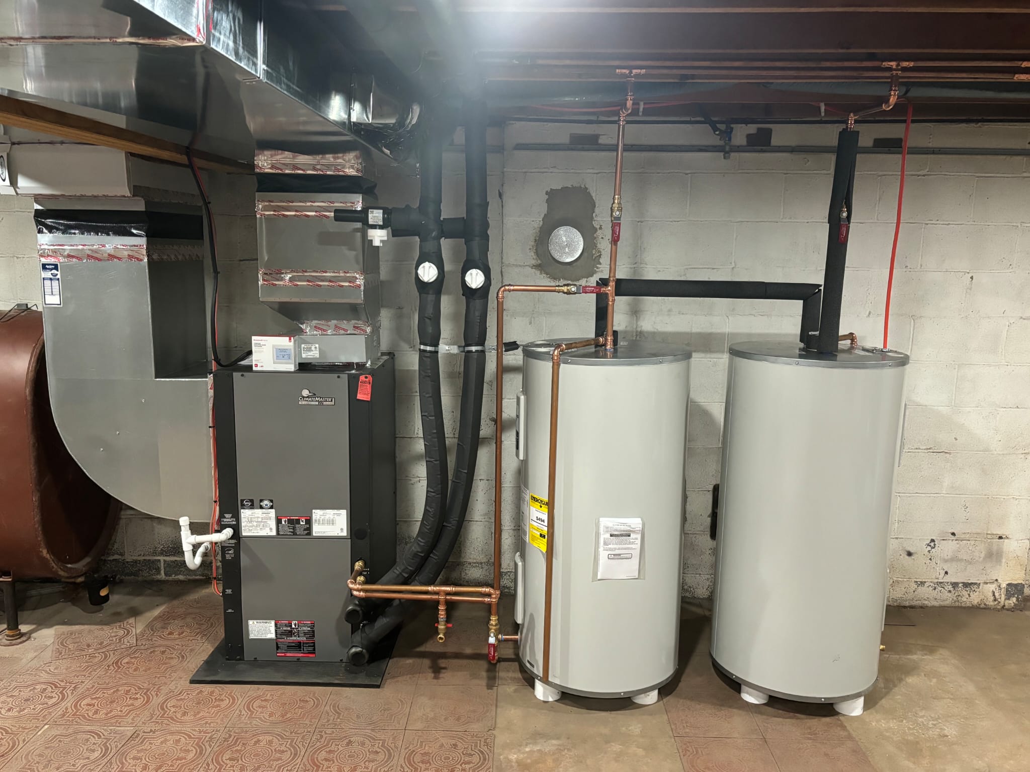 ClimateMaster geothermal system with dual water heaters
